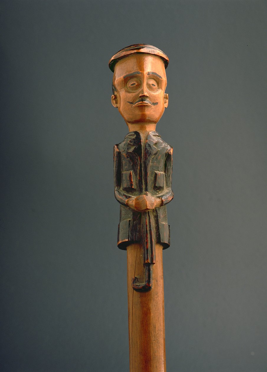 Stock mit einer Figur eines europäischen Mannes mit Mütze und Regenschirm, Ovimbundu, Angola, späte 19. Jahrhundert von African