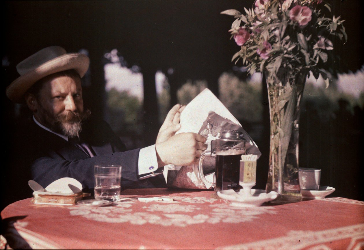 Frank Eugene sitzt am Tisch von Alfred Stieglitz
