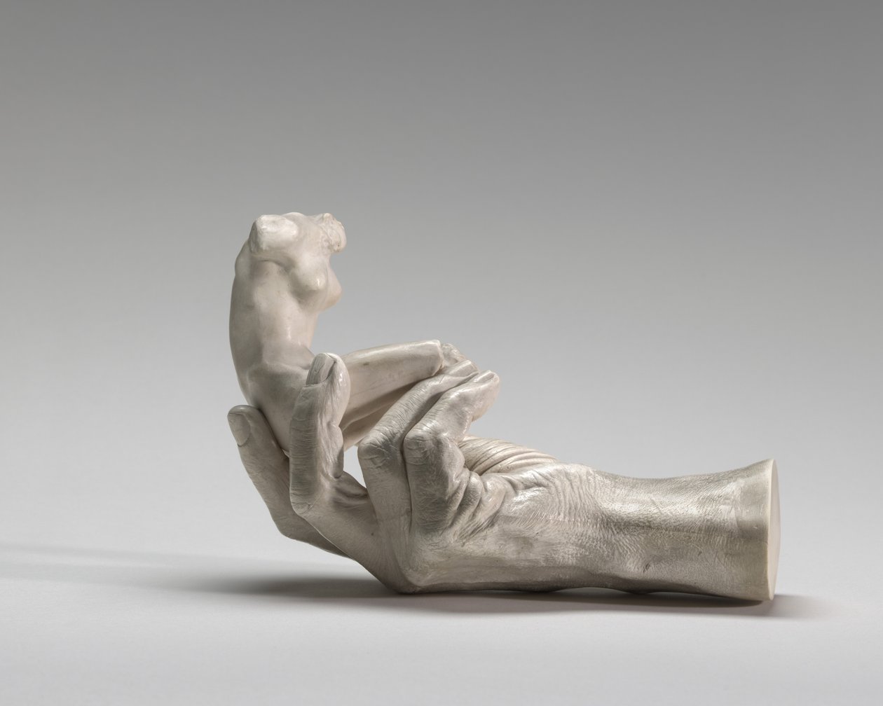 Hand von Rodin mit einer weiblichen Figur von Auguste Rodin