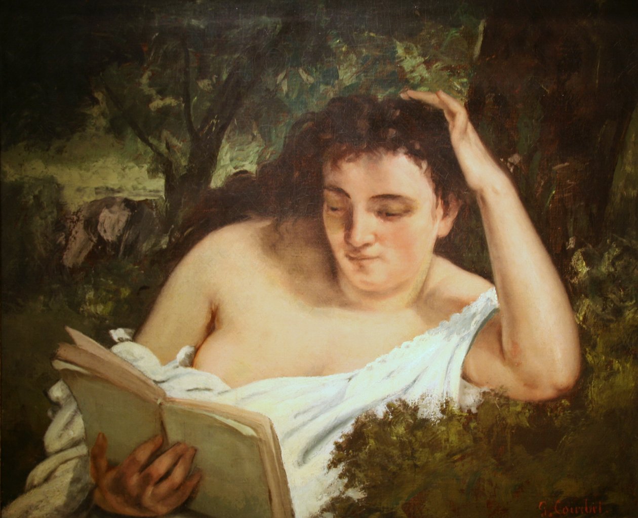 Eine junge Frau liest von Gustave Courbet
