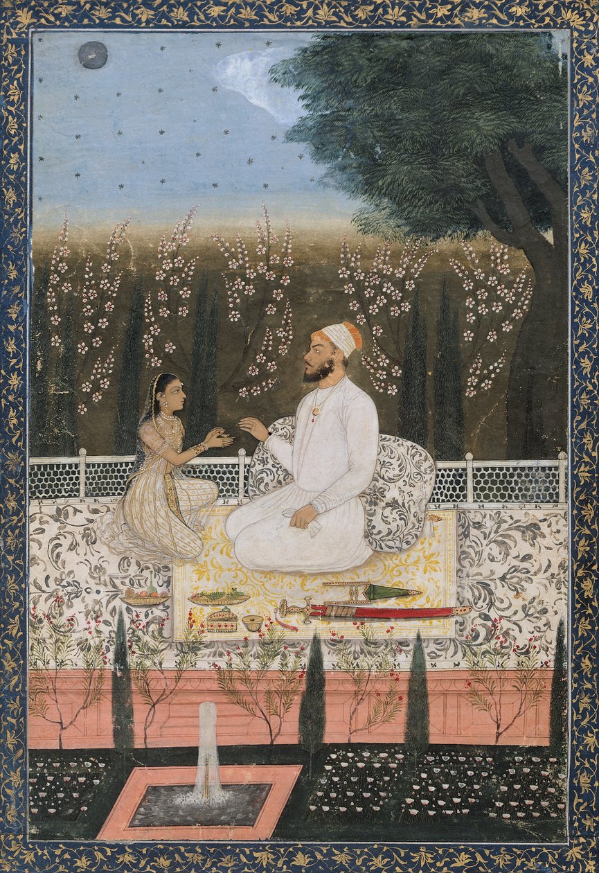 Paar auf einer Terrasse in einem Garten von Indian School
