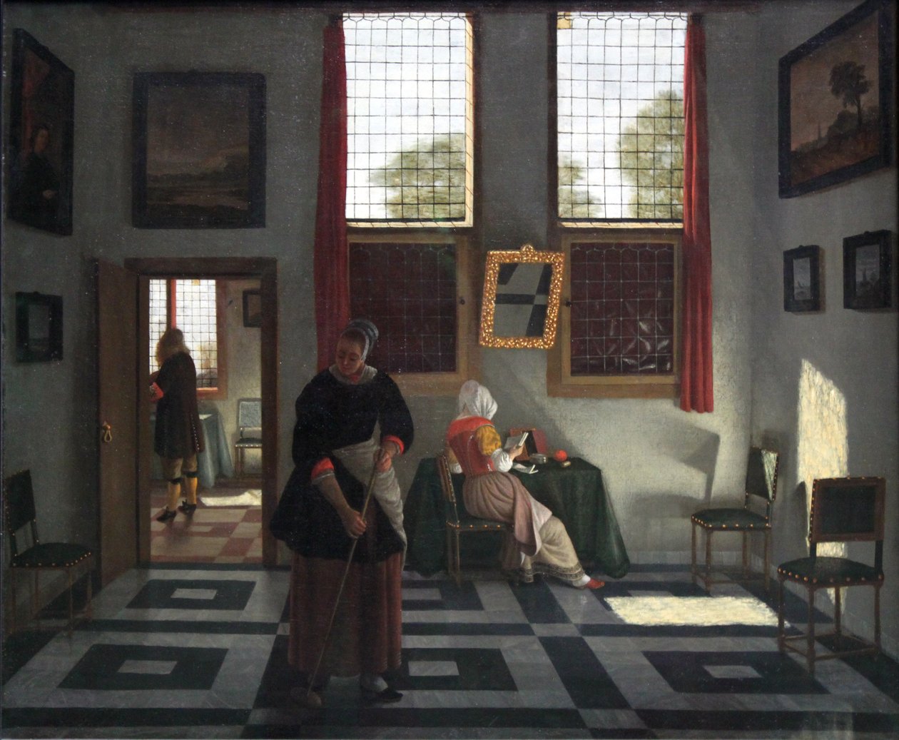 Interieur mit Maler, lesender Dame und kehrender Magd von Pieter Janssens