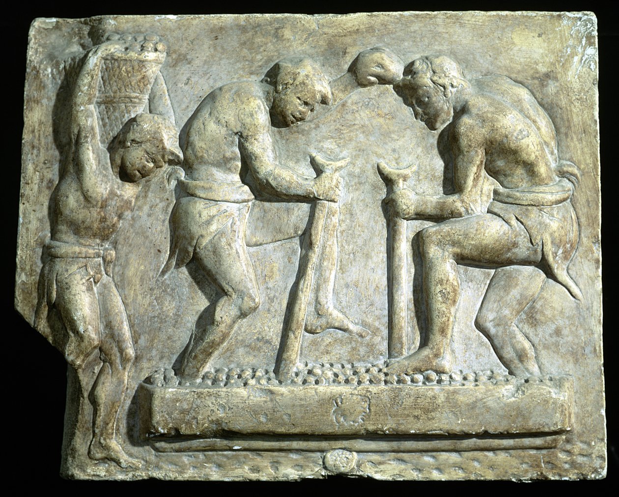Relief, das Pflasterer darstellt von Roman